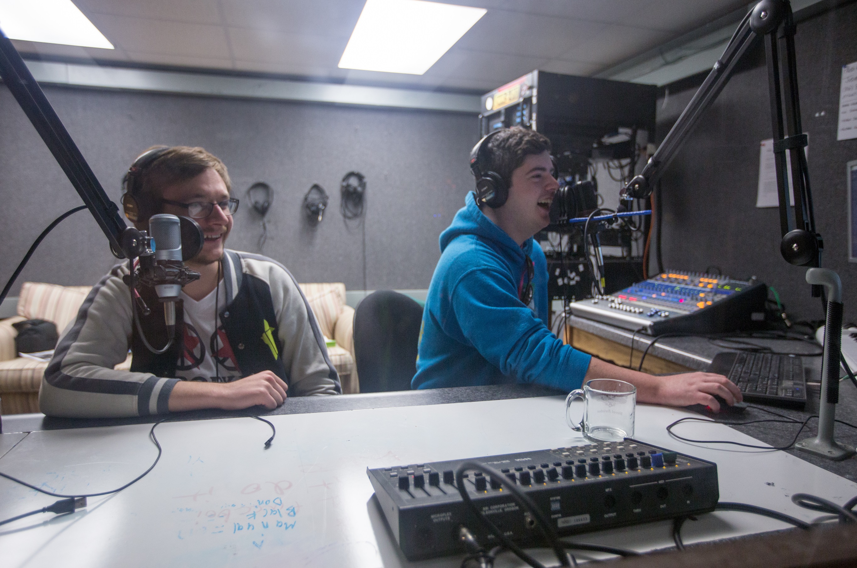 Image of students broadcasting from the KMNR studio